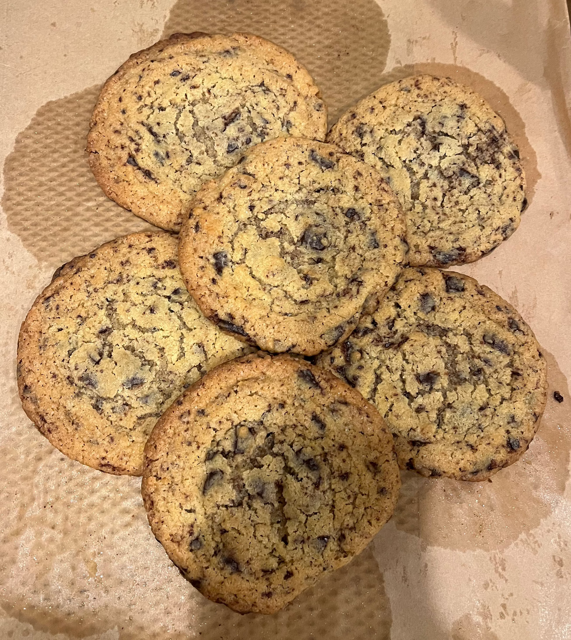 Cookies on a baking tray with parchment paper
