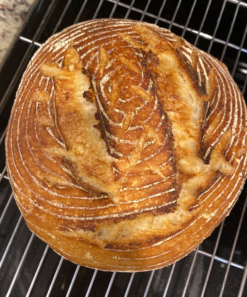 Loaf of bread on a cooling rack